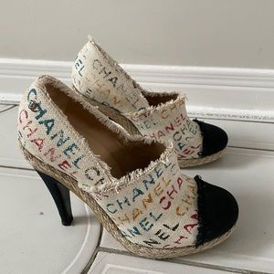 Authentic CHANEL pumps in Cream/Black Logo Printed Canvas